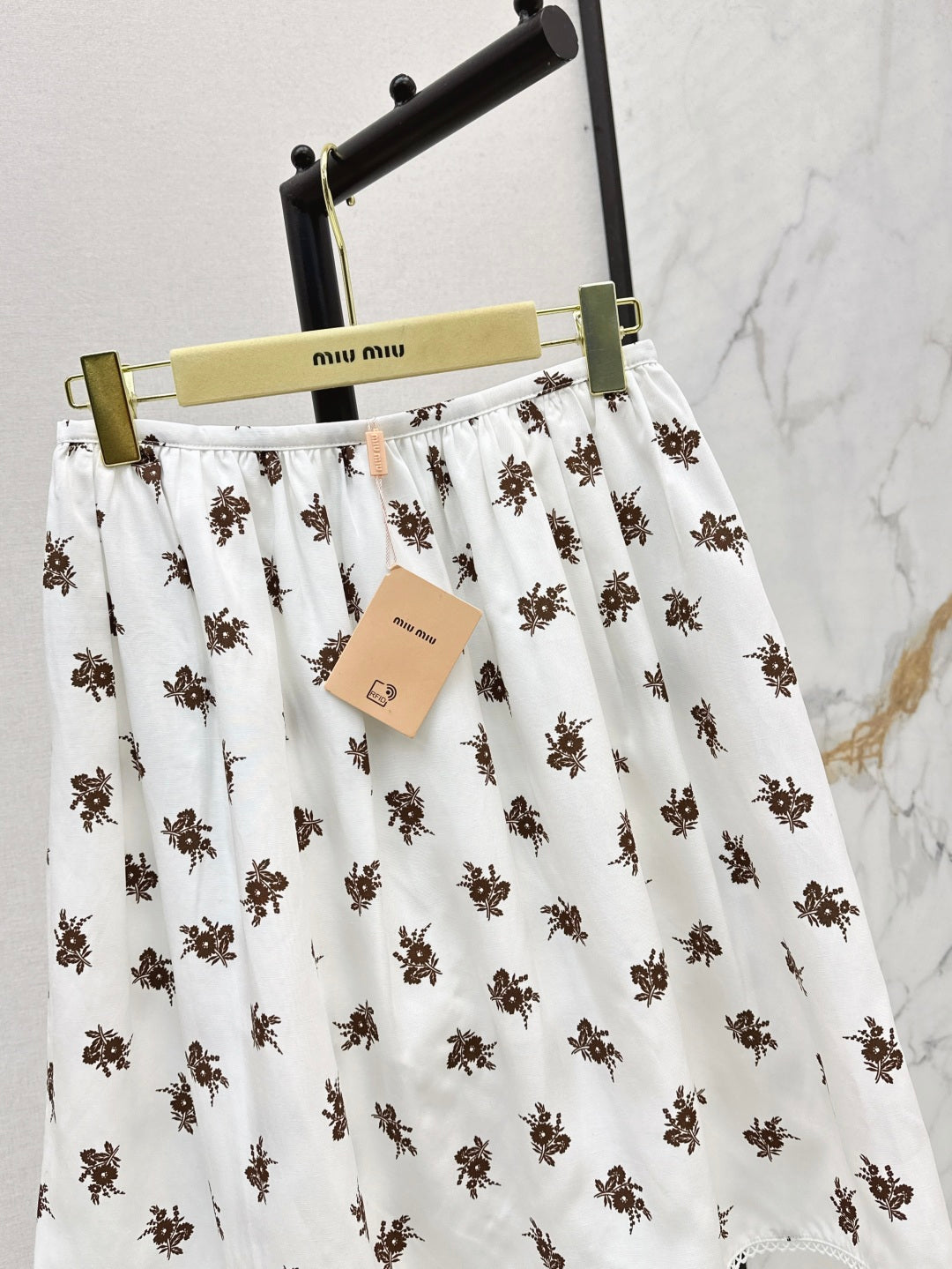 Miu 25ss print skirt