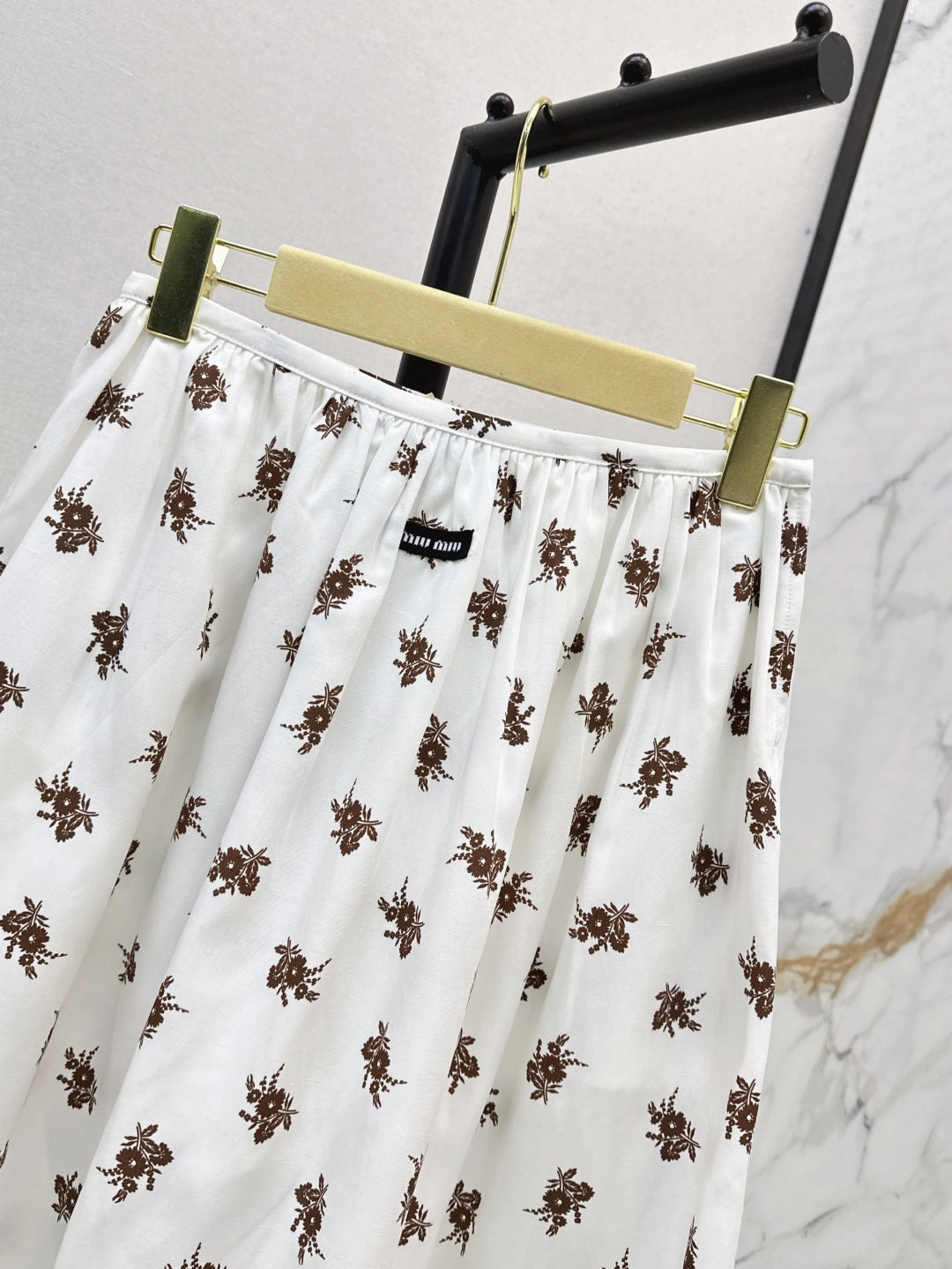 Miu 25ss print skirt